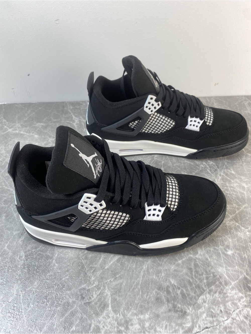 Jordan Black and White Low-Top Retro Sneakers